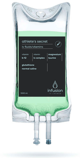 A bag of infusion with a green liquid in it.