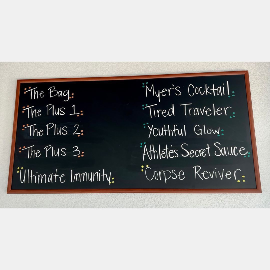 A blackboard with a list of drinks on it