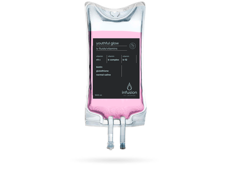 A bag of pink liquid with a black label on it.