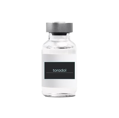 A bottle of toradol on a white background.