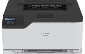 A white and black printer is sitting on top of a white table.