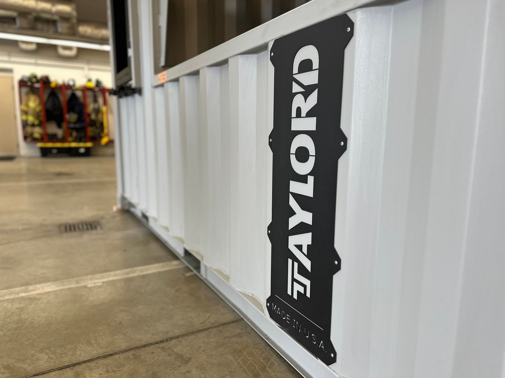 A sign on the side of a building that says taylord