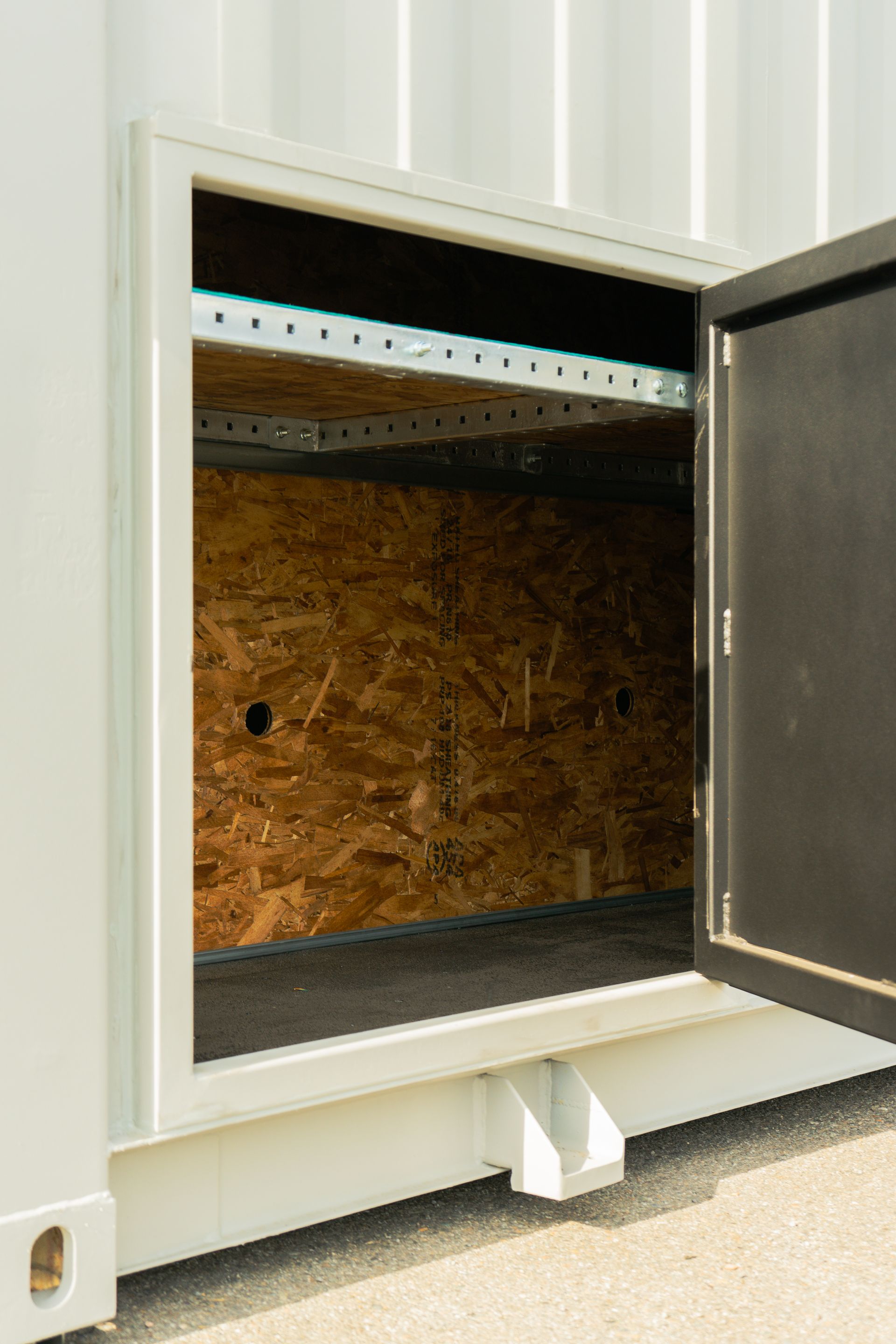 Looking through a hole in the side of a shipping container