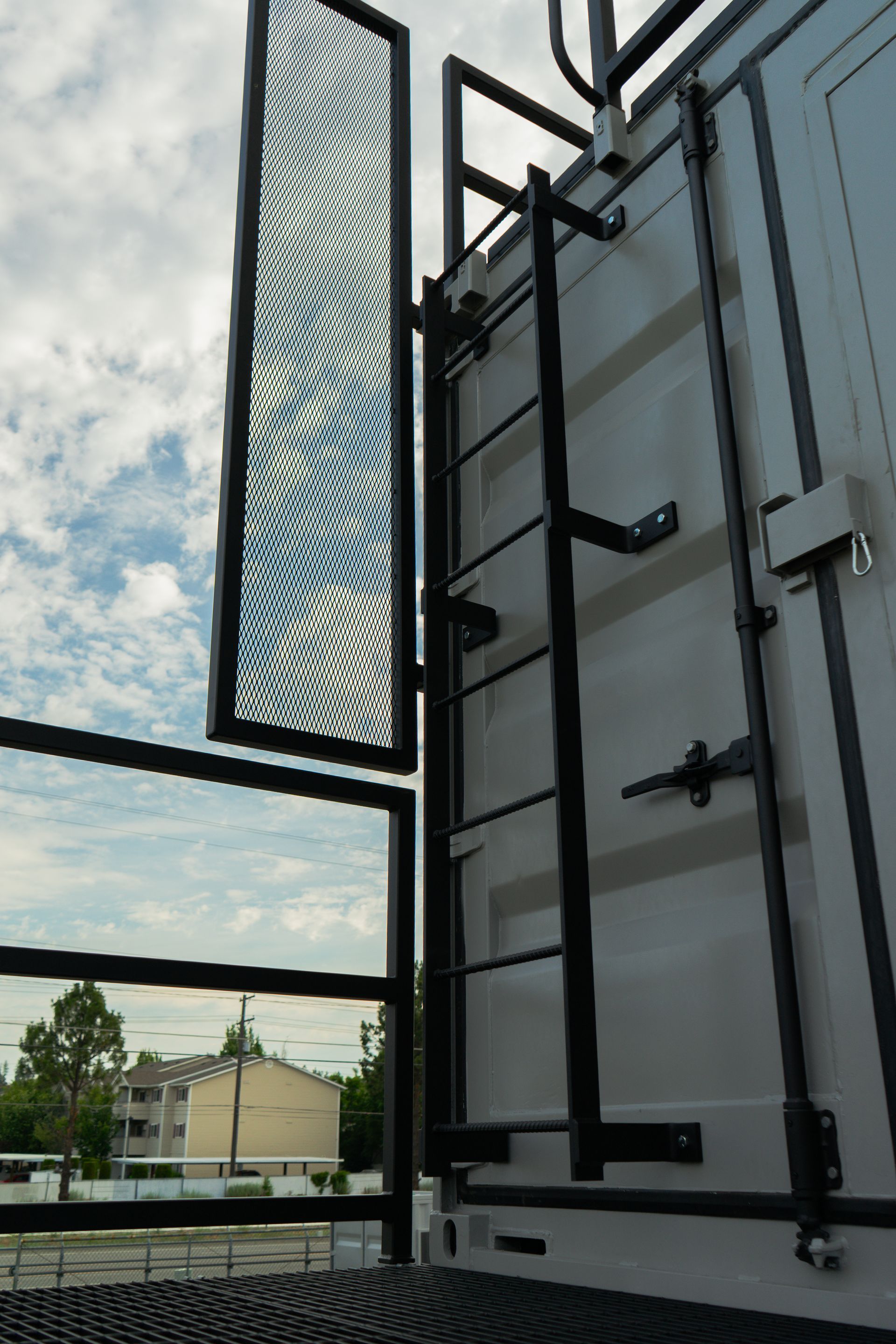 End of a shipping container with a ladder