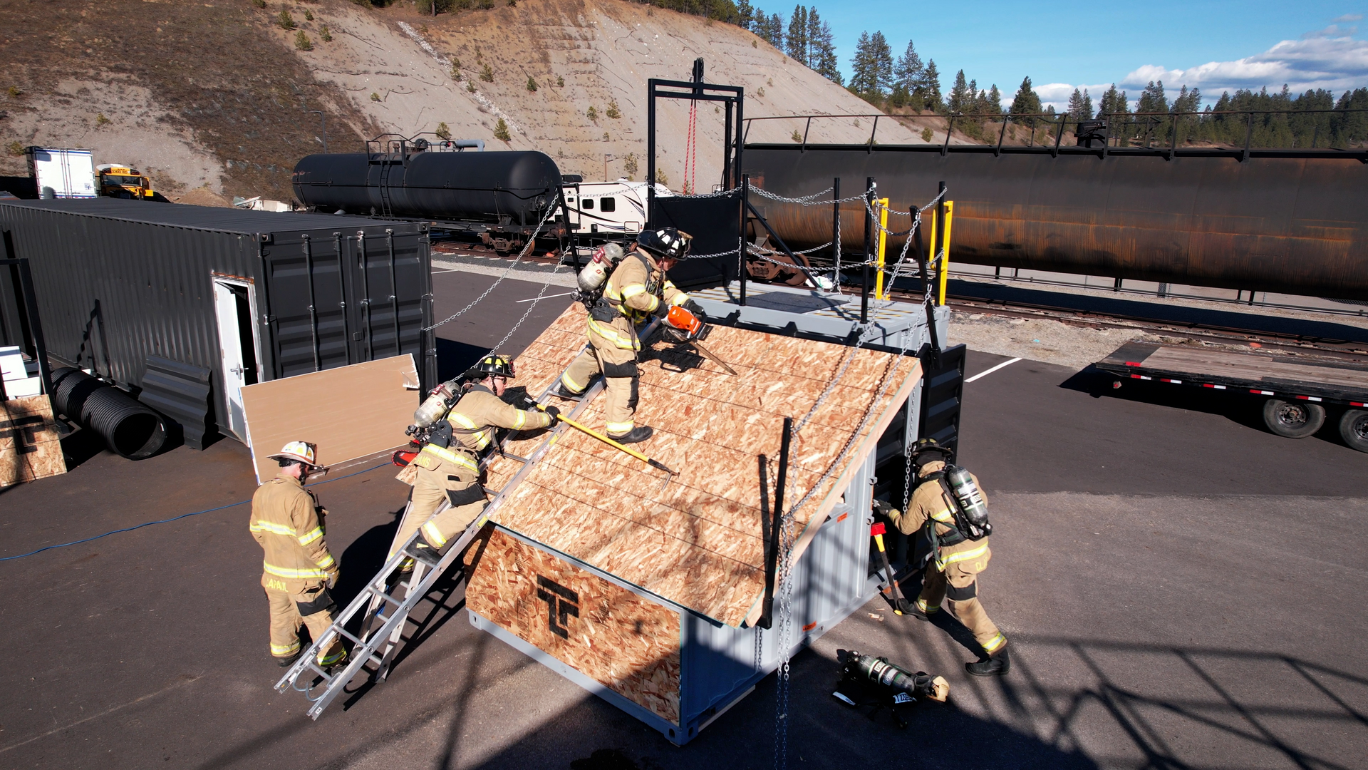firefighters training on top of a shipping container
