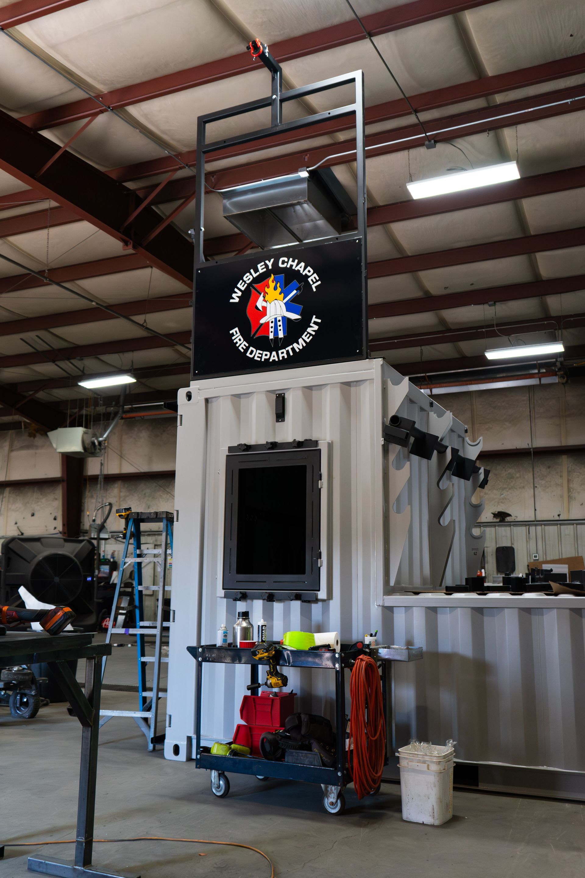 A firefighter training prop with the Wesley Chapel Fire Department badge