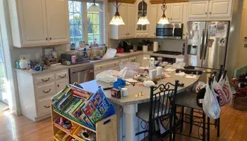 A kitchen with a lot of toys on the counter.