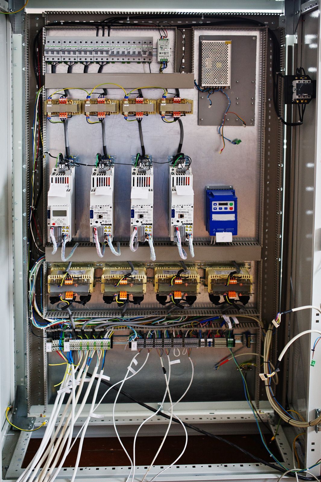 A very large electrical box with a lot of wires coming out of it.