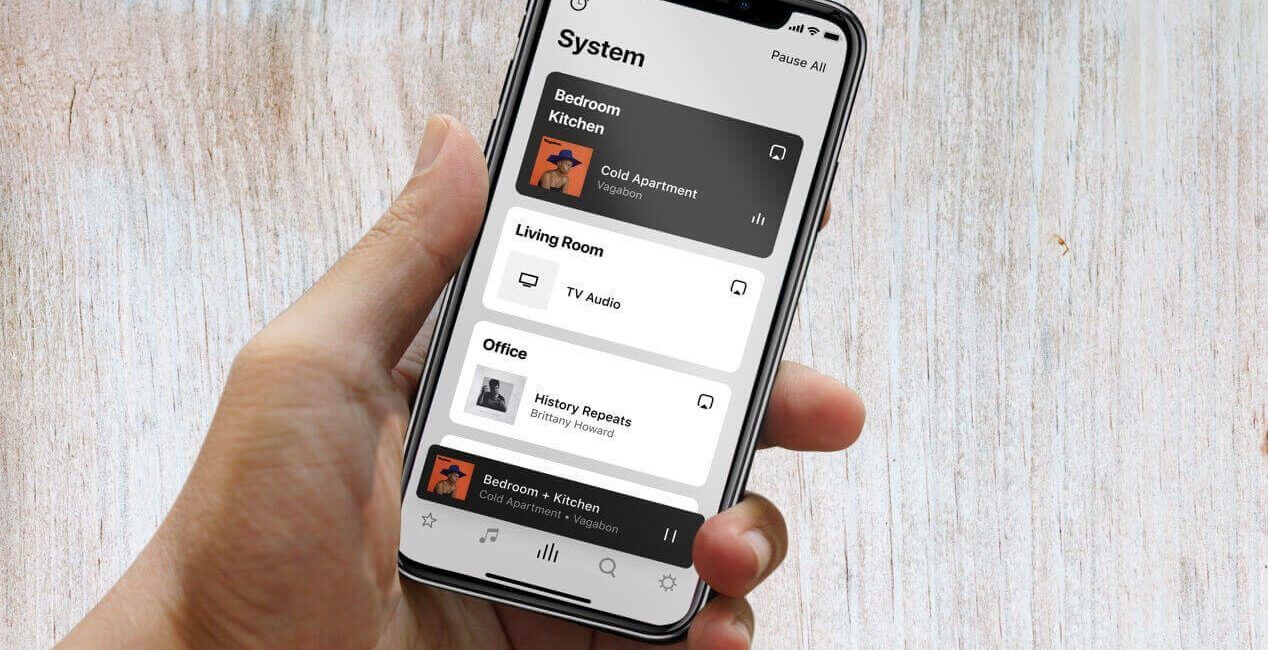 A person is holding a cell phone in their hand.