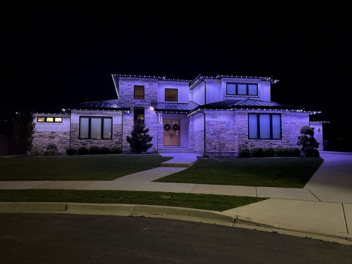 A house is decorated with Christmas lights and decorations.