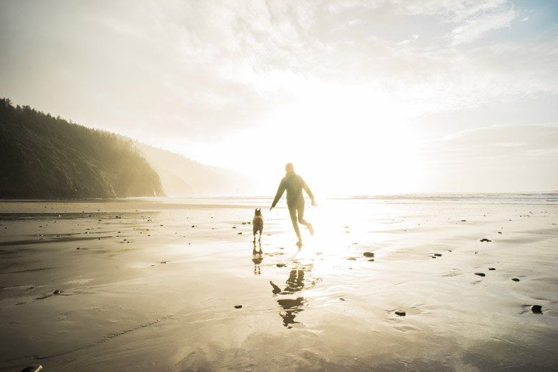 figures running on the beach
