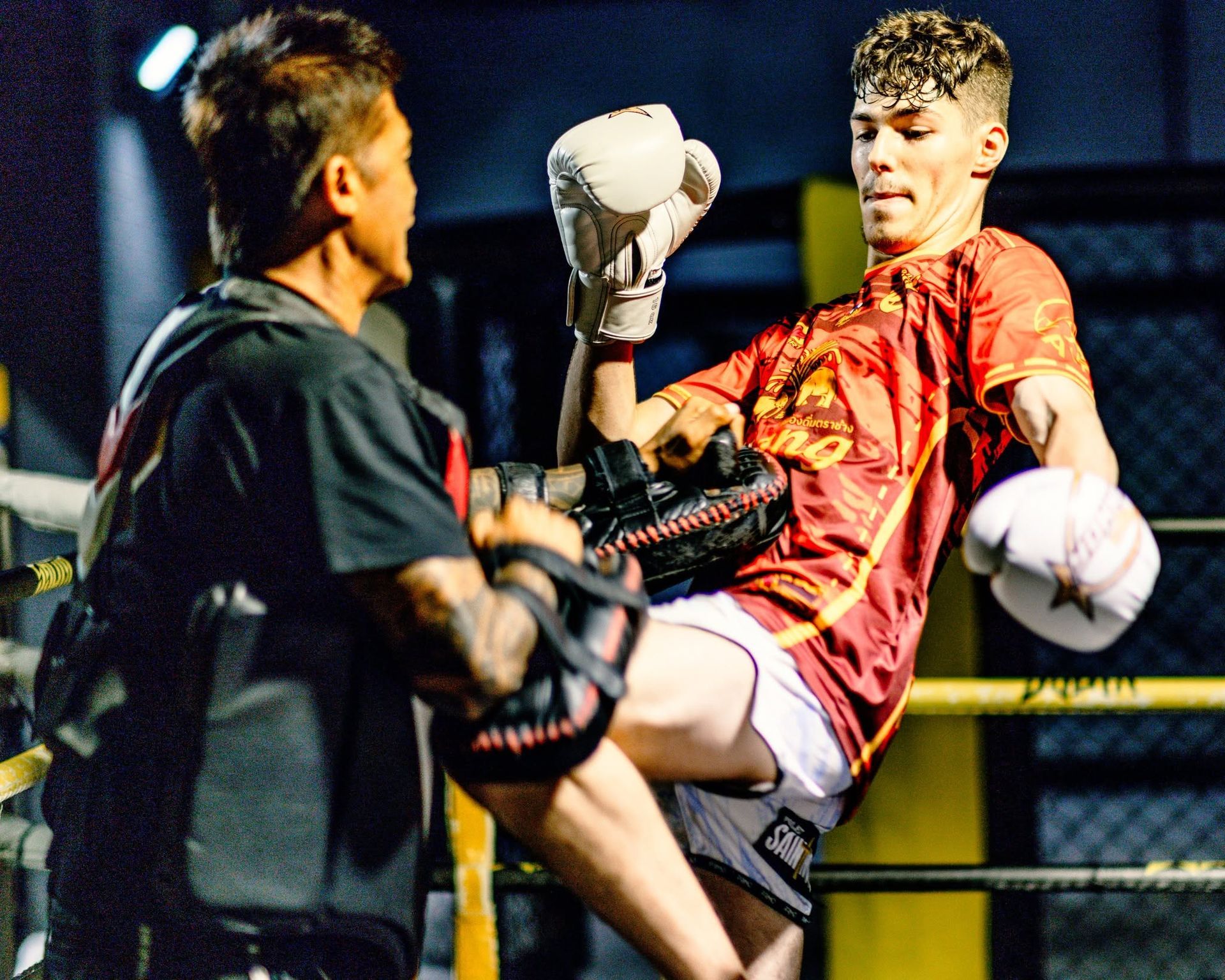Muay Thai Coach working with Kings Student