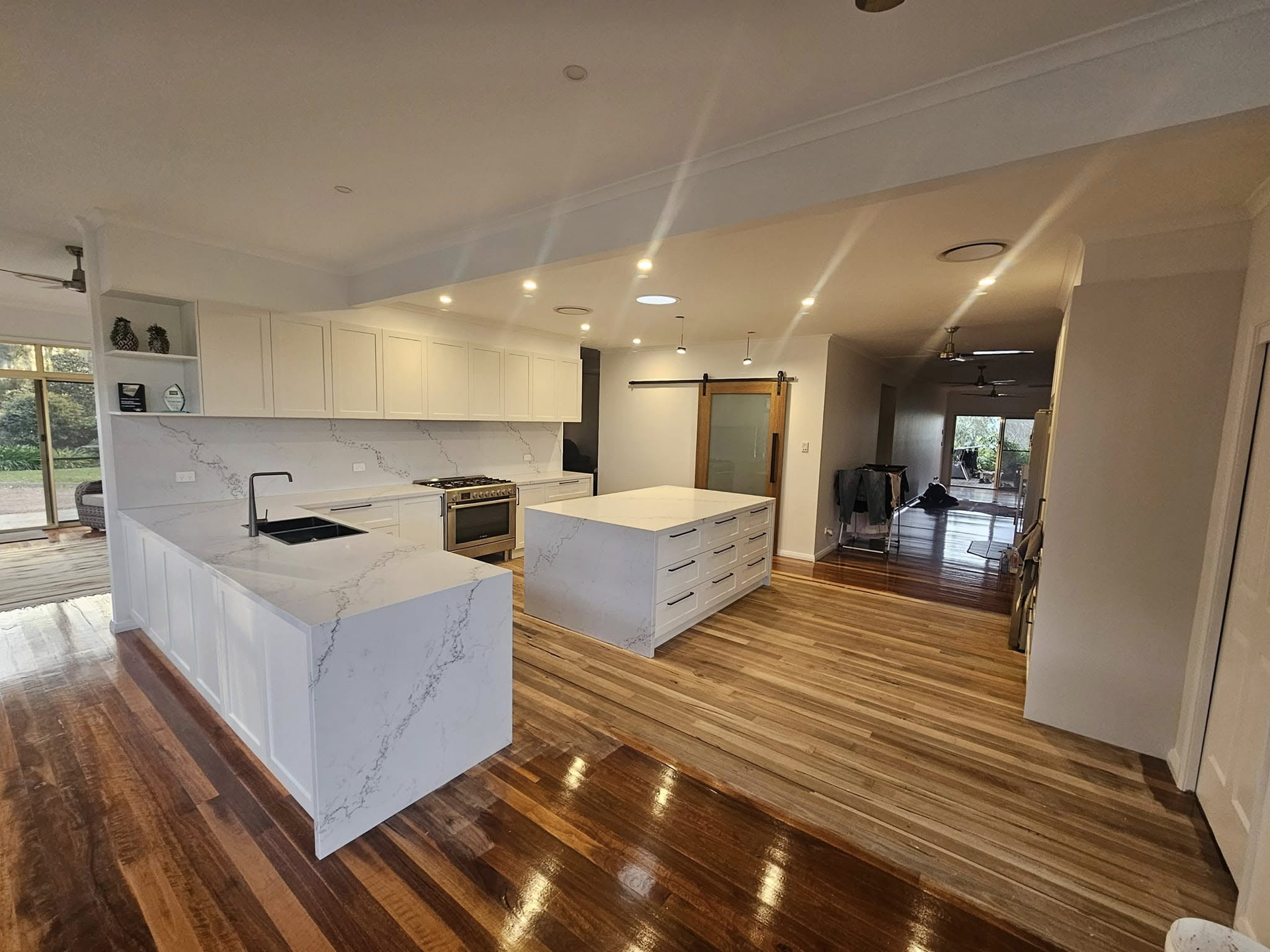 A kitchen with a large island in the middle of the room.