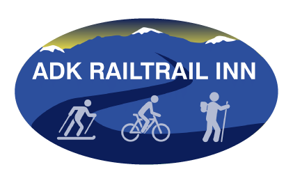 A logo for adk railtrail inn