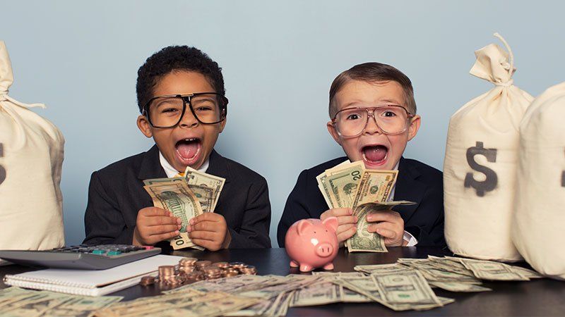 two children holding money
