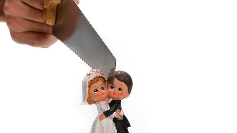 wedding couple figurine getting cut in half