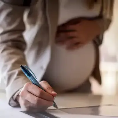 Pregnant employee at work