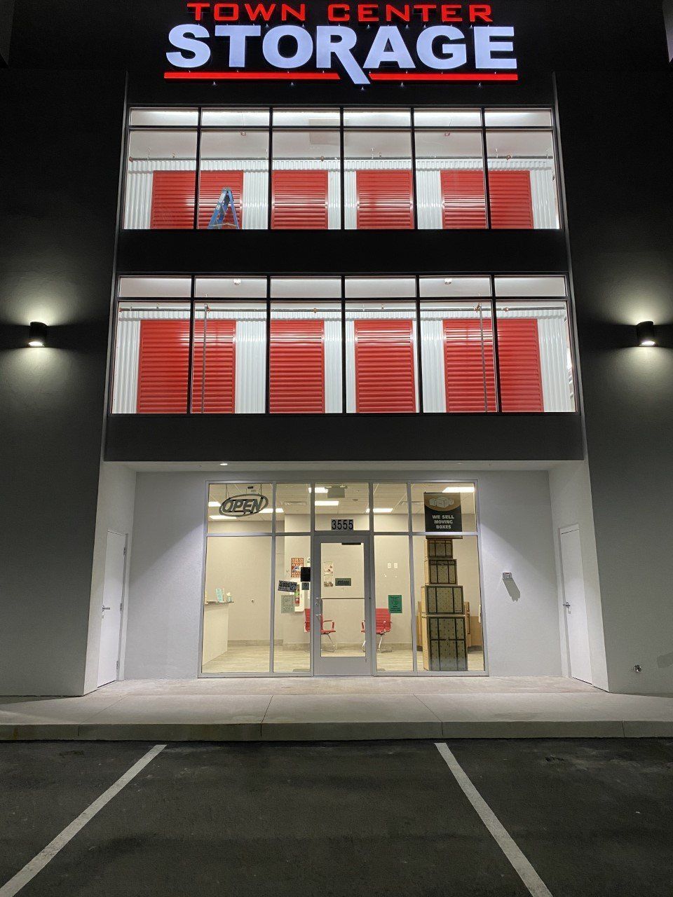 The town center storage building is lit up at night