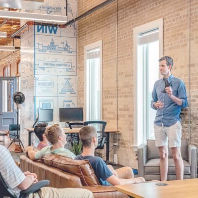 men in a corporate office having a meeting