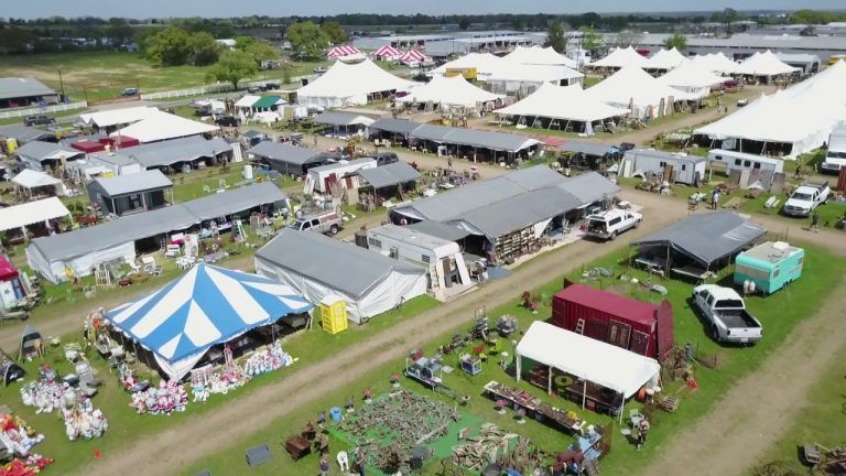 An aerial view of the round top antique show with lots of tents and buildings.