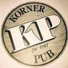 The korner pub logo is on a wooden sign.