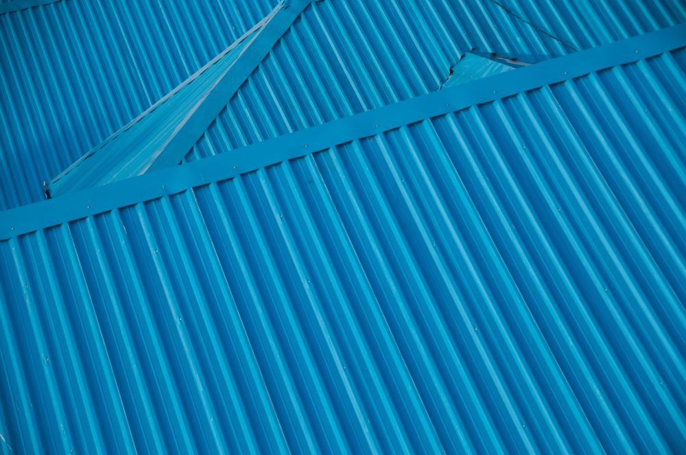 Blue Corrugated Metal Roof — GCX Roofing In Ashmore, QLD