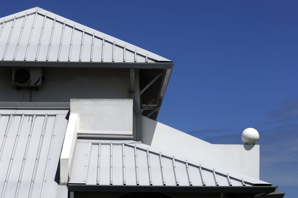 White Metal-Roofed Building — GCX Roofing In Ashmore, QLD