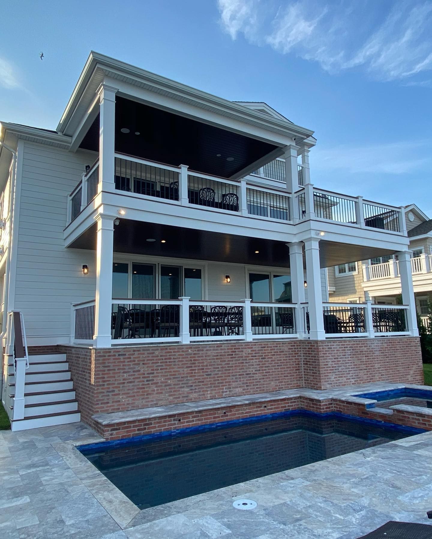 White beach house with pool, deck, and stairs built by j.k. construction llc in sea isle city, nj