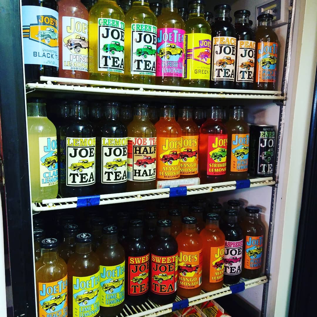 A fridge filled with bottles of joe tea