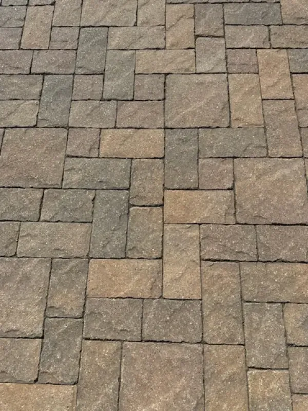 A close up of a brick pavement with a diagonal pattern