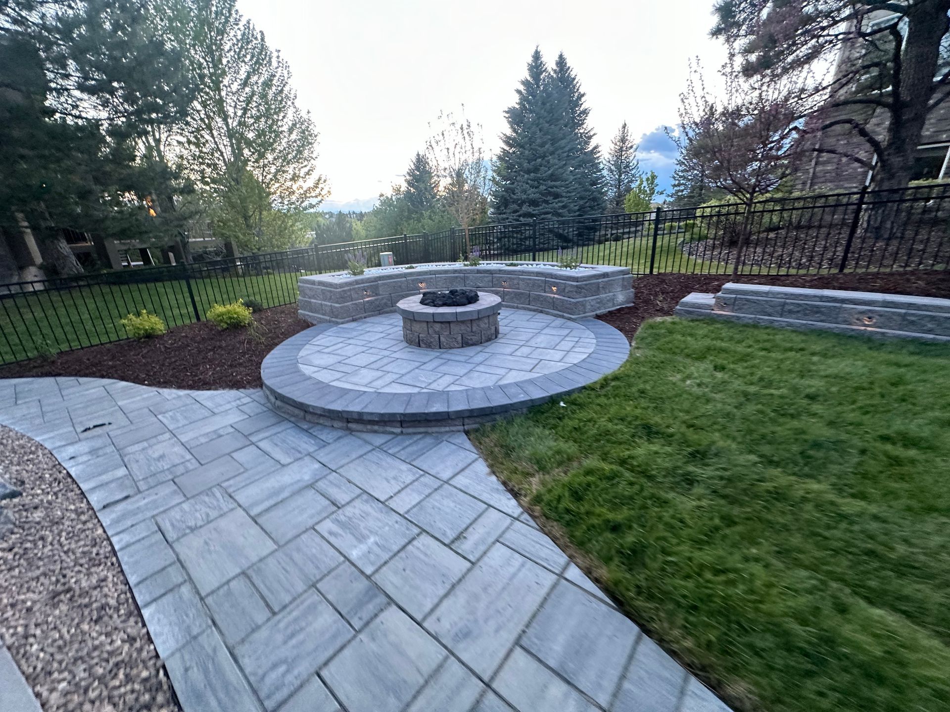 There is a fire pit in the middle of the patio.