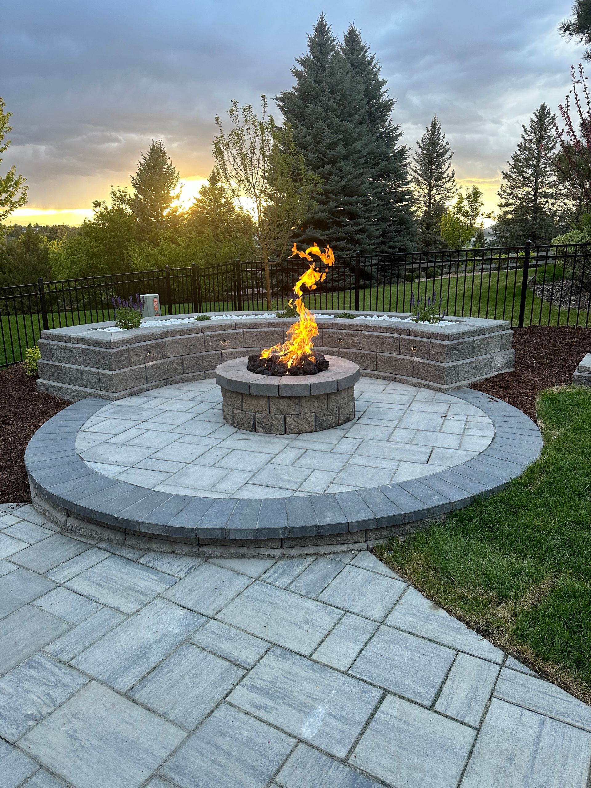 There is a fire pit in the middle of the patio.