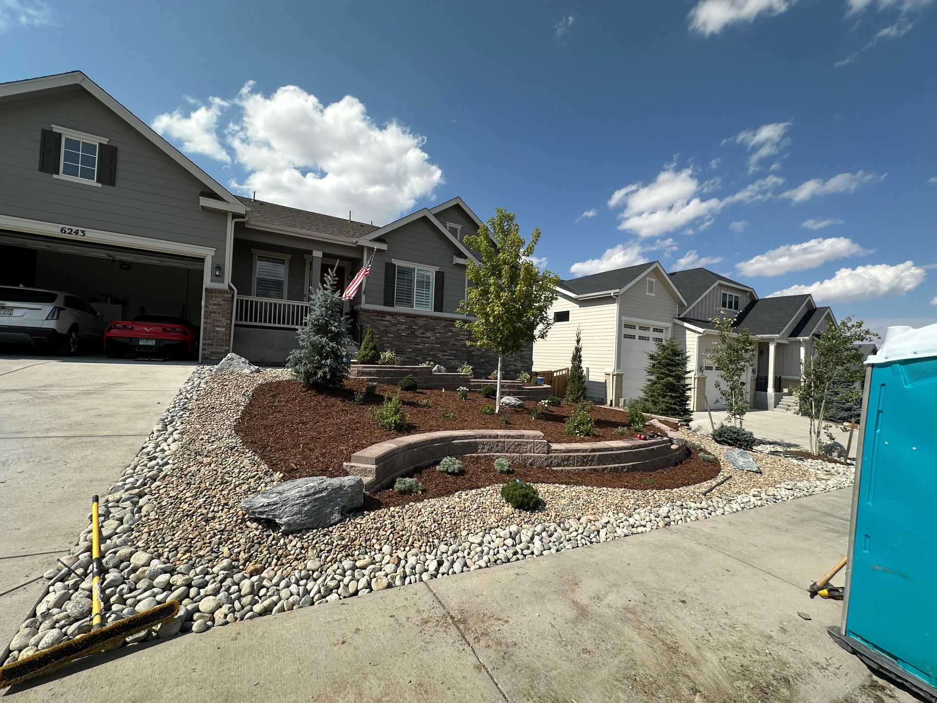 A house with a lot of rocks in front of it
