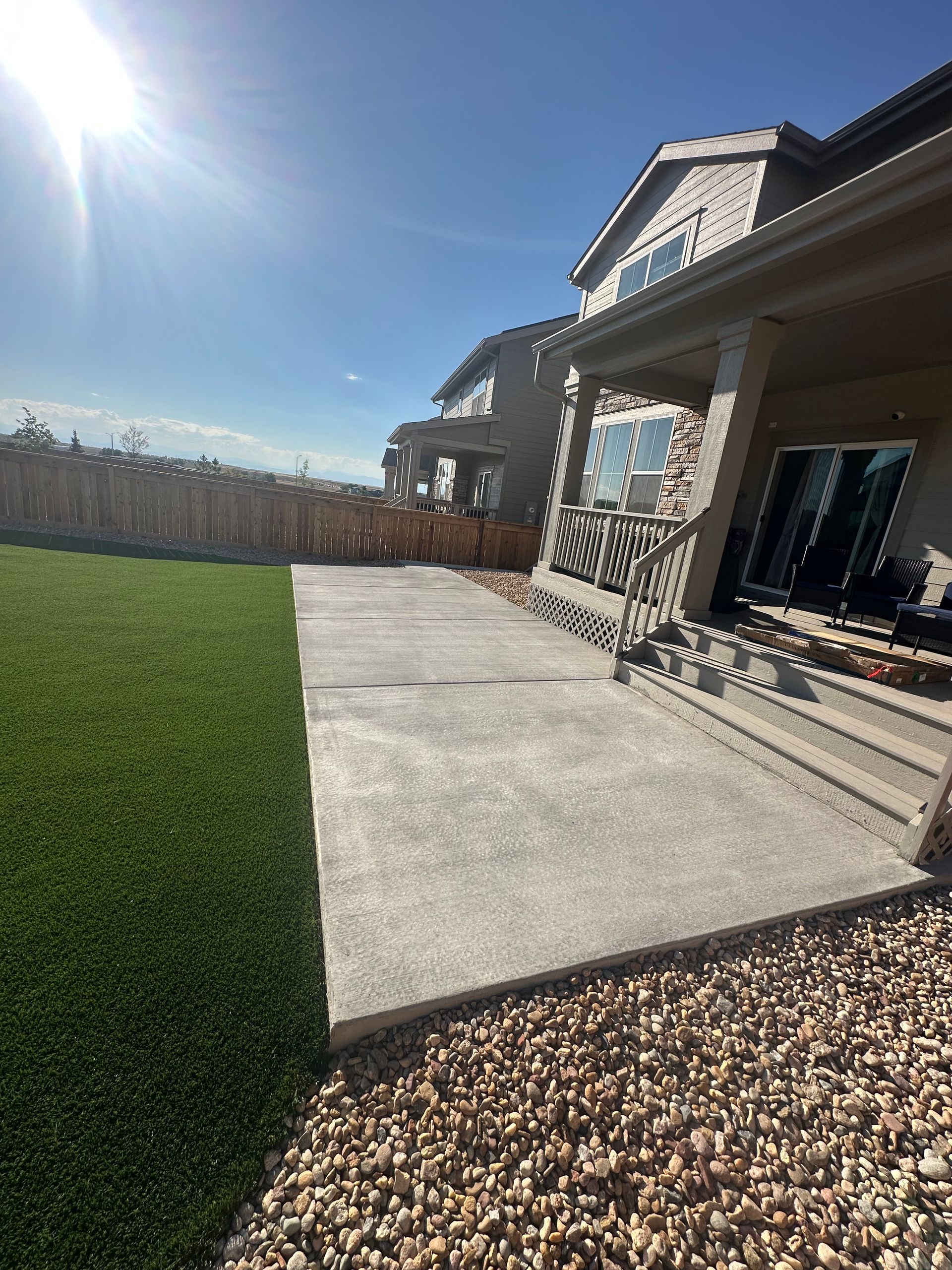 A large house with a large lawn in front of it.