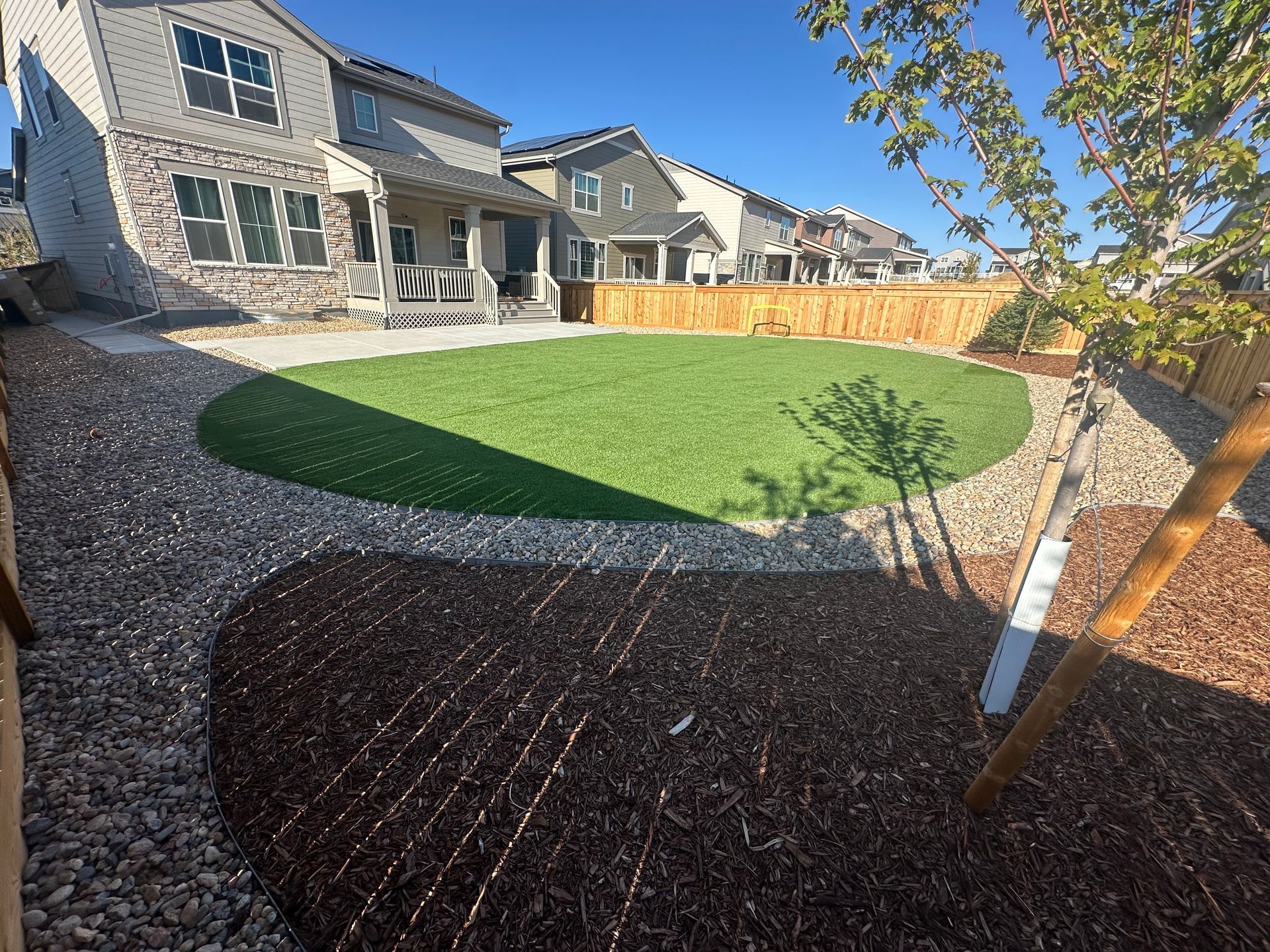 A large house with a large lawn in front of it.