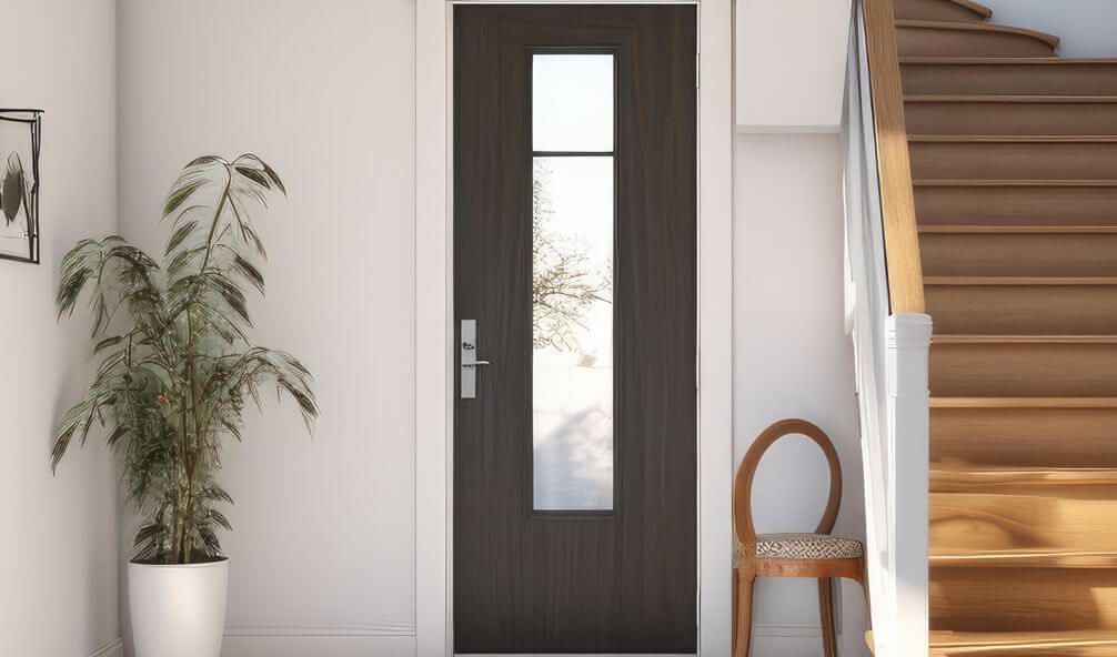 A hallway with a door , chair , plant and stairs.