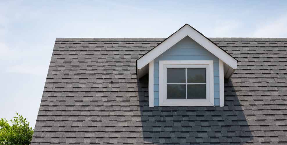 A house with a small window on the roof.
