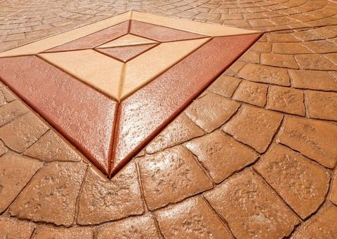 Earth-toned tiles with center shapes installed by professional concreters in Melton VIC.