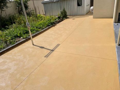 Coloured concrete driveway for a residential property in Sunbury VIC.