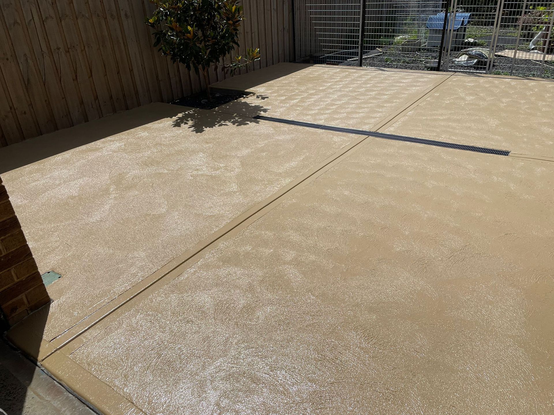 Coloured concrete driveway in Melton VIC adding a touch of personality to outdoor spaces.