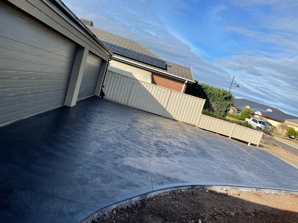 Seamless extension of a concrete driveway in Melton VIC.
