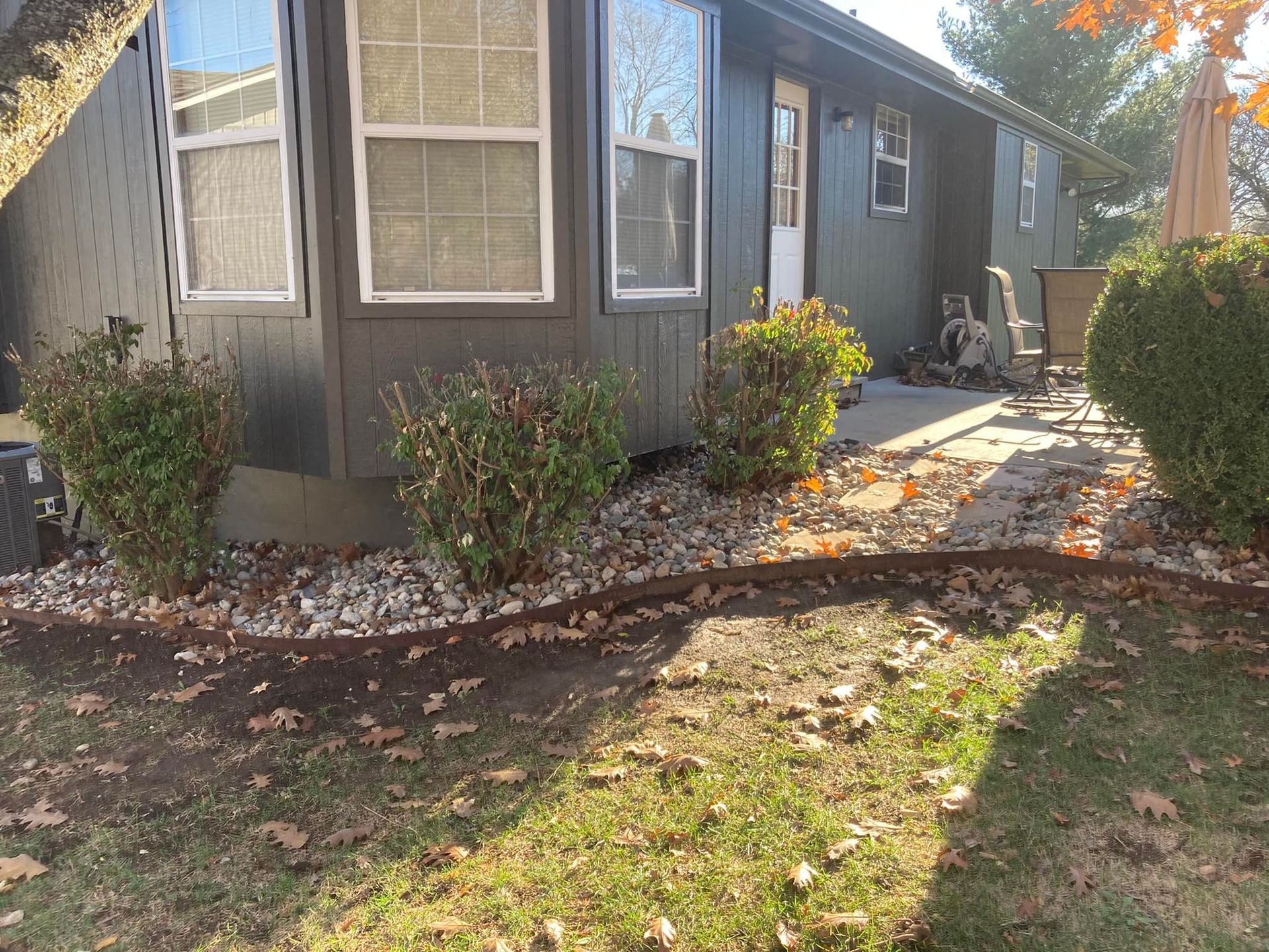 A small house with a lawn in front of it.