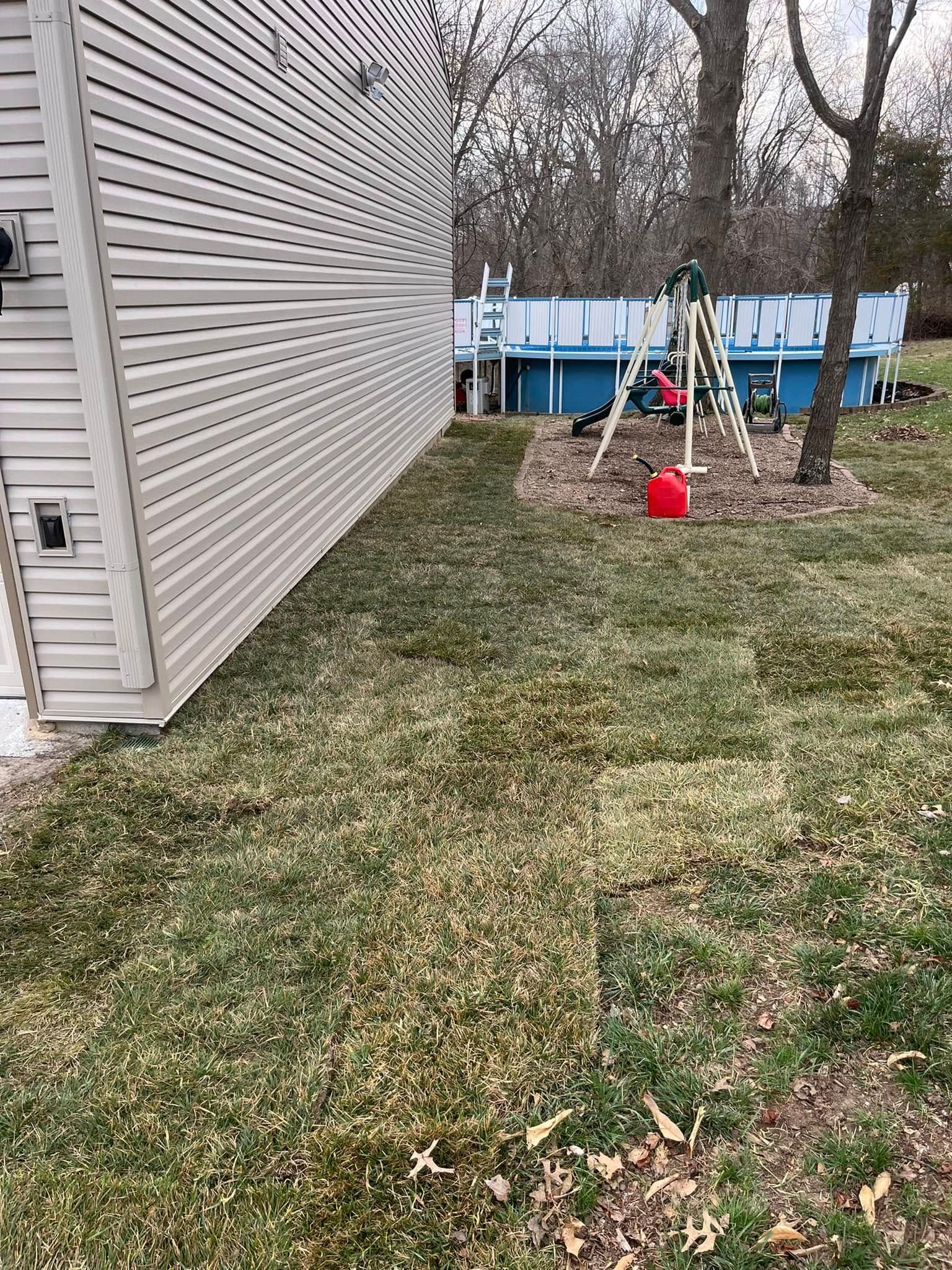 A house with a pool in the backyard and a playground in the backyard.