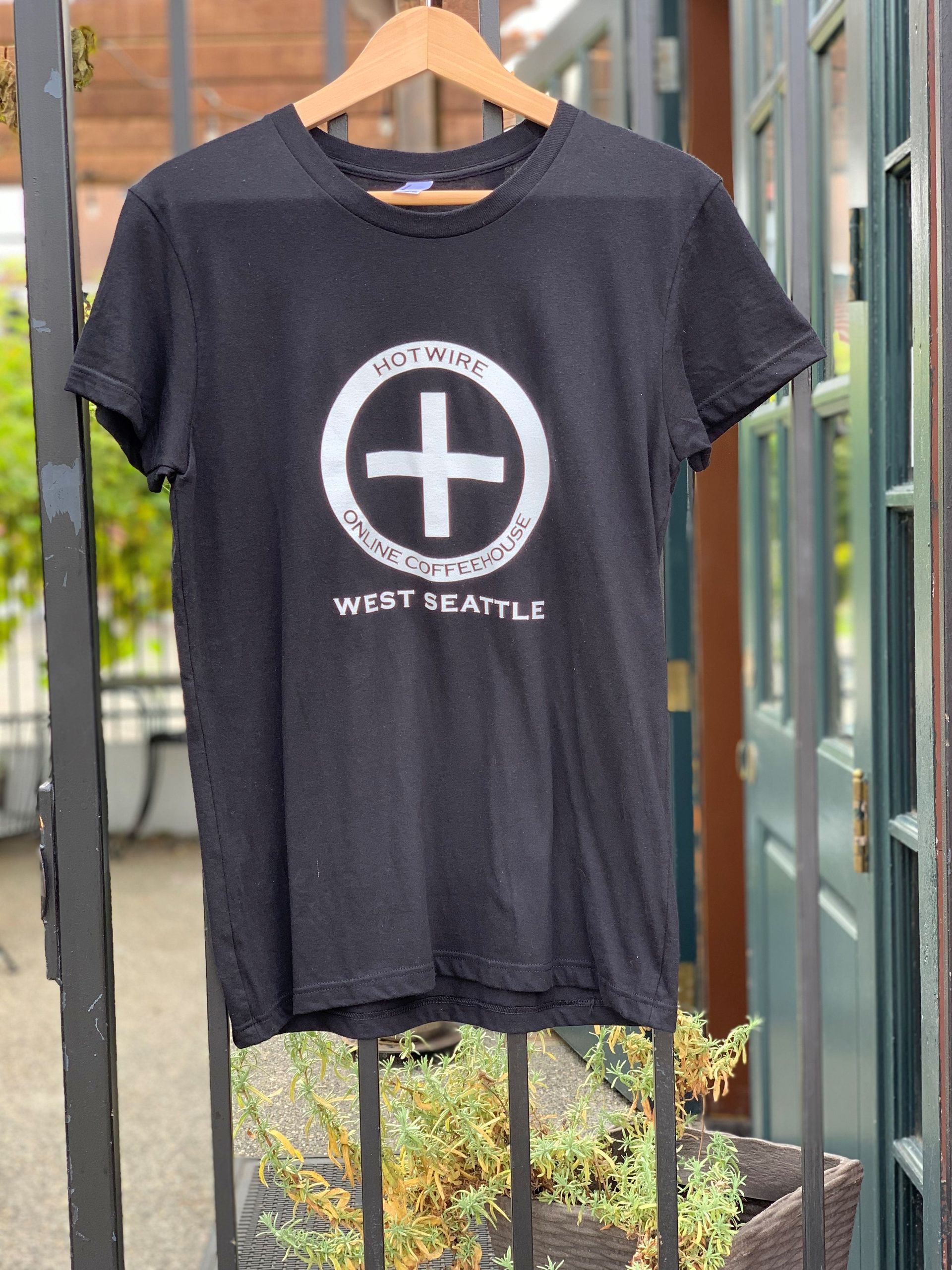 Black t-shirt with a white plus sign graphic,