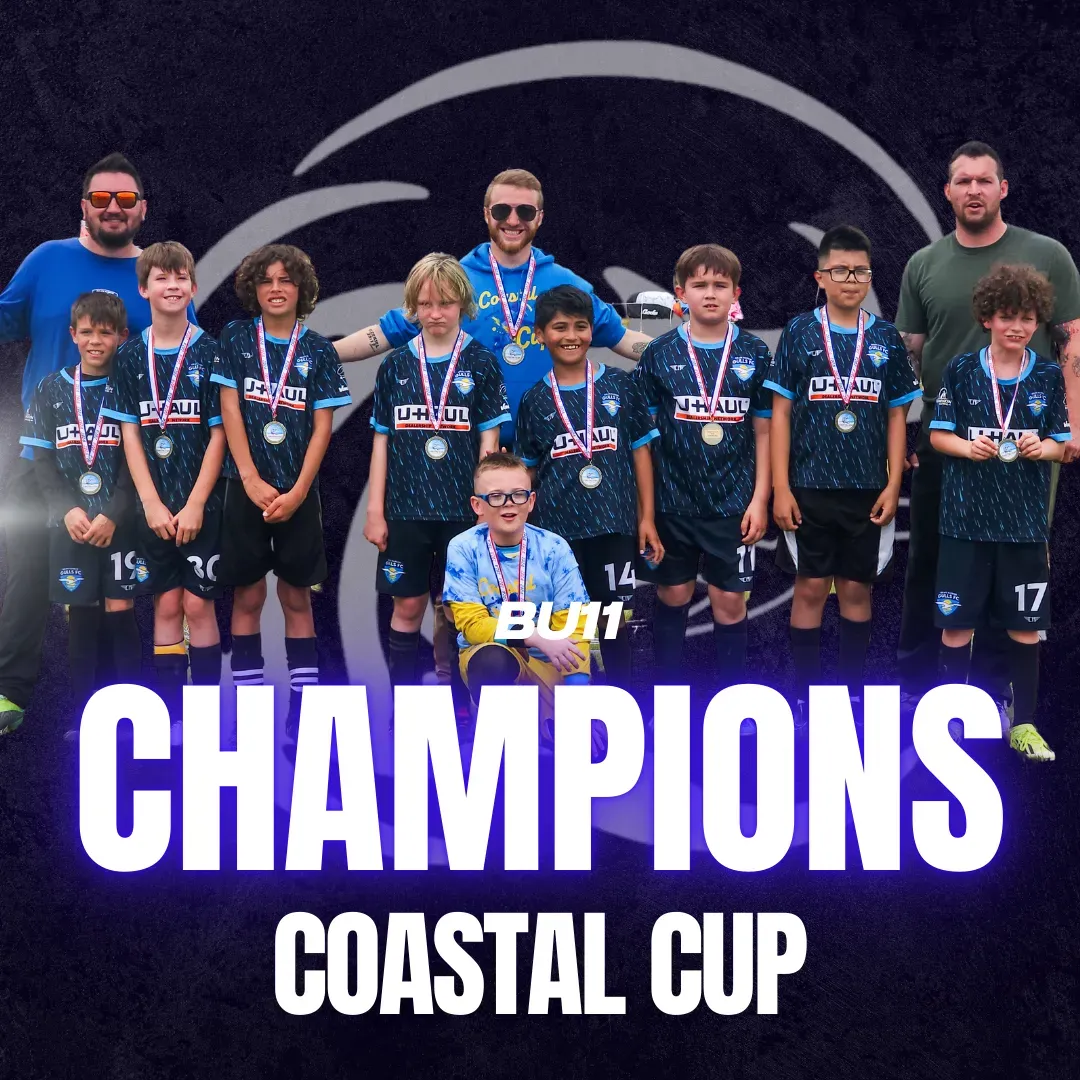 Soccer team in blue and black jerseys, medals, 