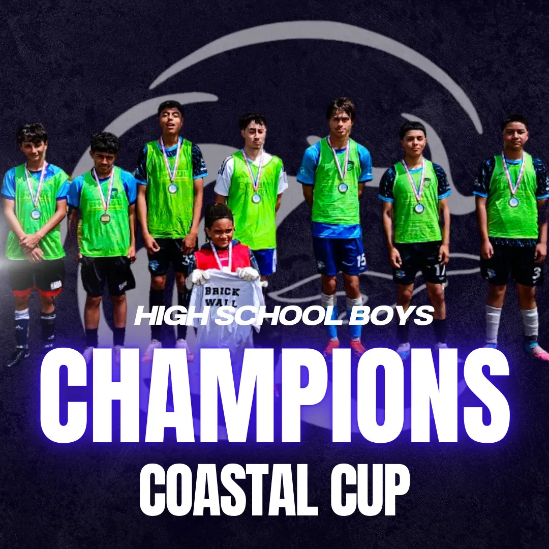 High School Boys soccer team, Champions of the Coastal Cup, standing together with medals.