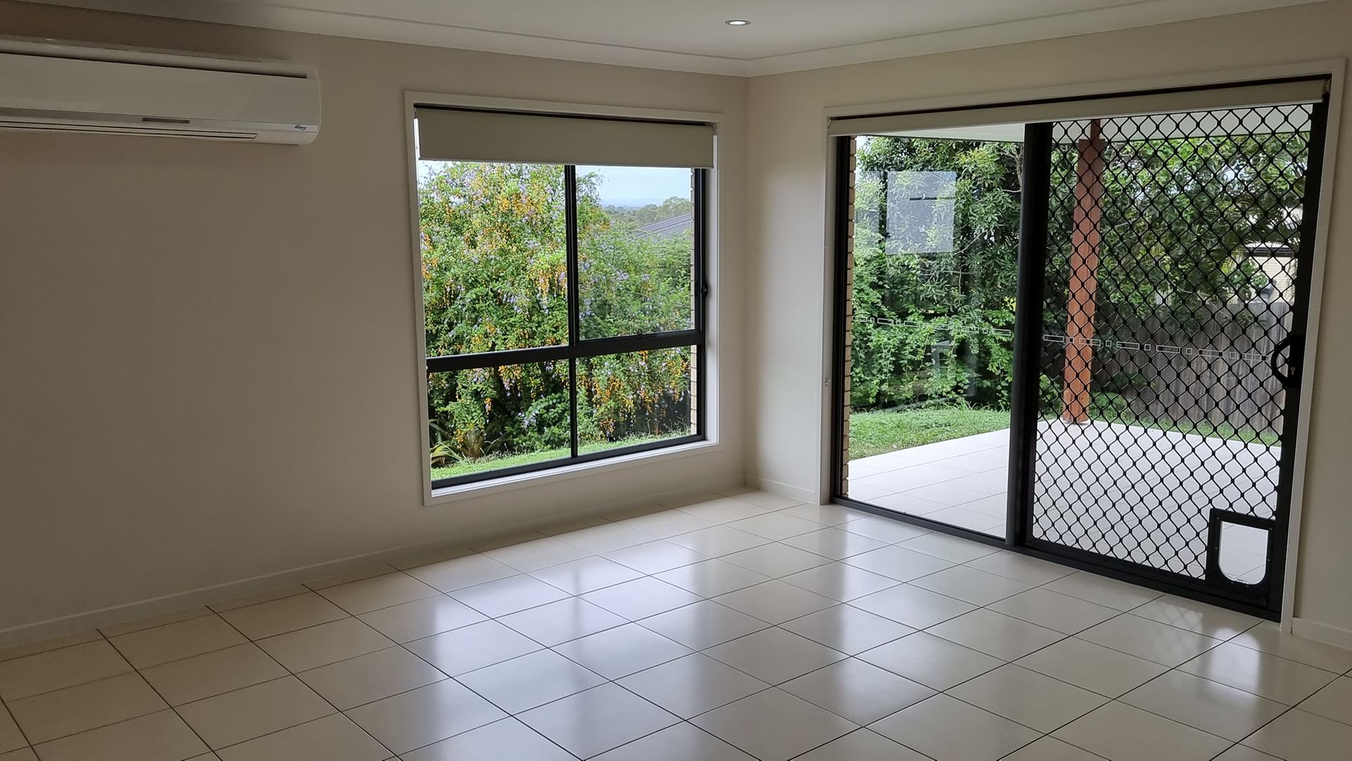 Person Cleaning Window — Professional Cleaning Company in Pialba, QLD