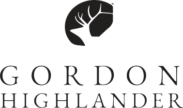 Black silhouette of a stag's head with antlers above the name 