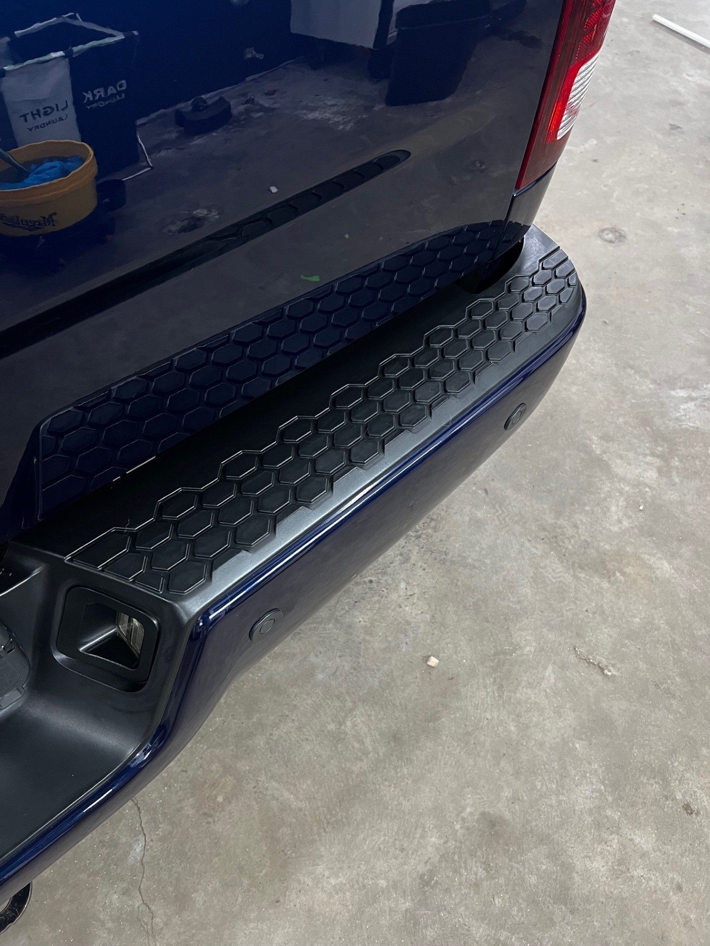 Close-up of restored black trim showing deep color and even finish after professional detailing