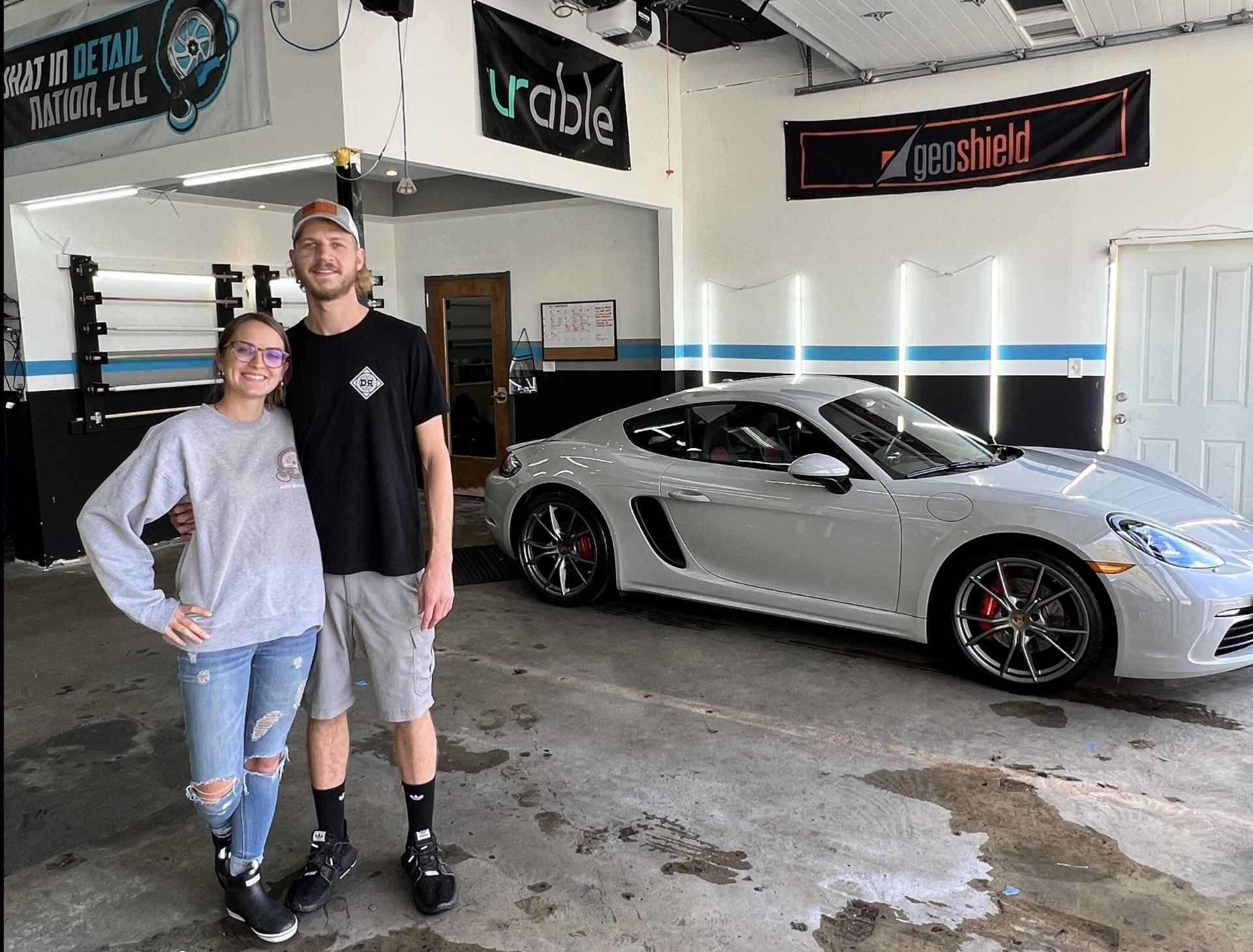 Certified ceramic coating professionals working on vehicle